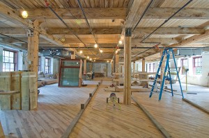 The original wooden floors and Douglas fir posts and beams will remain exposed in the phase two renovation of the Alton Mill. Photo by Pete Paterson.