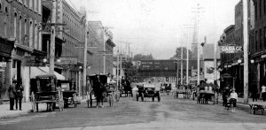 In the early twentieth century, a lone auto driver navigates among the carriages on Brampton’s Main Street. Photo Courtesy Region Of Peel Archives.