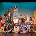 The cast and some of their mentors take a break from rehearsal. Back row, diagonally from left : Virginia Chambers, Rachel Griffith, Daniel Reale, Michelle Vieira, Michael McCreary, Leela Scott. Second row, seated : Jayde Lavoie, Justine Tompkins, Bridget O’Rourke, Jane Ohland Cameron, Erica Causi, Megan Saul. Second row, standing : David Draper, Lindsay Whiting, Eric Goldrup, Nicole Robertson, Holly Bus, Mariel Bulcan-Gnirss. Front row, sitting and kneeling : James Gerus, Jasmine Lagundzija, James Peters, Dean Harris, Megan McCreary. Photo by Pete Paterson.