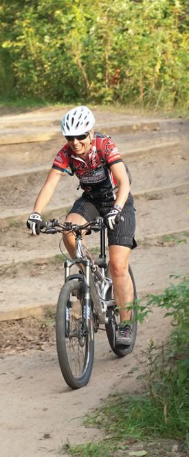 On the trail : Novice mountain biker Nicola Ross successfully navigates steps on the trail at Mono Cliffs park. Photos Pete Paterson