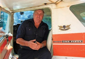Potato and cattle farmer Jim Black in his Cessna 150: “What are we going to say to our kids, our grandkids, when they ask, ‘What happened around here? Why is this hole in the ground?” Photo by Bryan Davies