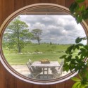 A porthole view of the outdoor dining area. Photo by MK Lynde.