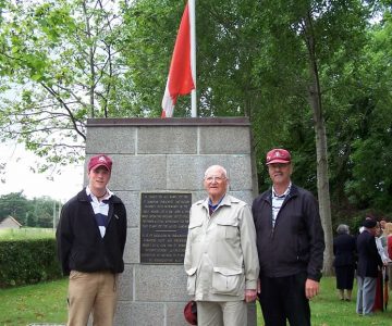 Three generations: James, Thomas and David Jackson standing at the crossroads in France that Thomas helped defend as part of the Normandy assault on the morning of June 6, 1944.