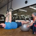 Trainer Tony Fenech has been putting Orangeville mayor Rob Adams through his paces for about four years, usually in the gym at Big Tyme Fitness and Boxing, but sometimes for variety on the playground equipment of a local school. Photo by Rosemary Hasner / Black Dog Creative Arts.