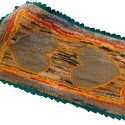 A hooked rug made by Edith (Phair) McMillan of Orangeville, ca 1940. The McMillan family operated a service station on the south side of Broadway. Photo by Pete Paterson.