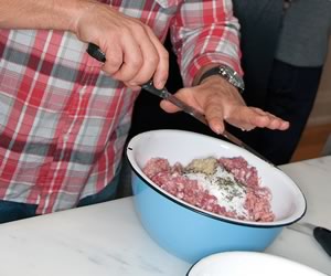 Chef Fabio Bondi prepares and grinds a Tamworth pork shoulder. Photos by MK Lynde.