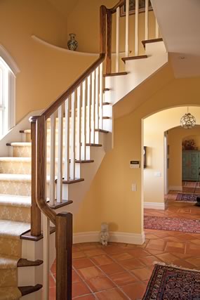 This western staircase is matched by one on the east side of the house and joins in a gallery leading to guest rooms.