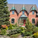 From the outside this Mono house is a classic replica of the Ontario Gothic Revival style at its finest, complete with elaborate gingerbread and elegant finials on its triple gables, and polychromatic brickwork.