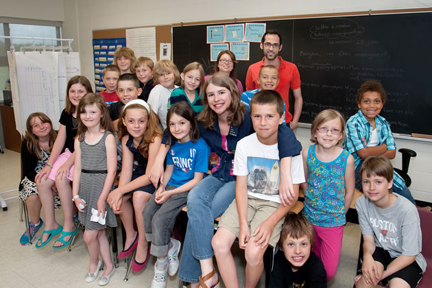 On the last day of school, a group of Grade 4, 5 and 6 Quatre-Rivières students gathered for an impromptu photo with teachers Mme Champagne and M. Ziani (at rear). Photo by Rosemary Hasner / Black Dog Creative Arts.