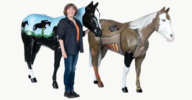 Ellen Cameron with her entry in the Parade of Horses, along with a steampunk-themed entry painted by Judy Sherman and Eva Folks.
