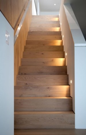 Oak stairs lead to a bright and roomy basement. Photo by Pam Purves.