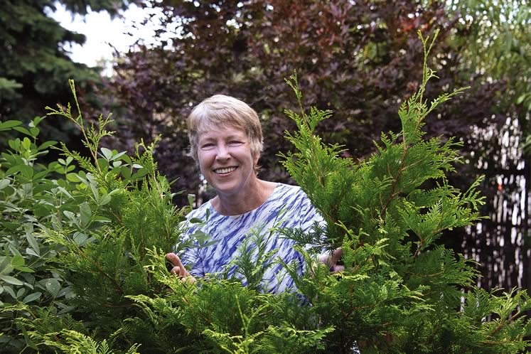 Lynn Sinclair-Smith tends the Friendship Gardens. Photo by Pete Paterson.