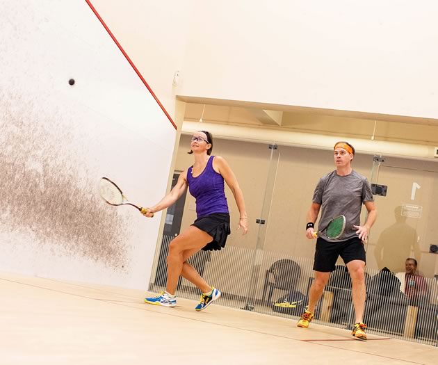 Squash pro Leah Desbarres (left), ranked for many years among Ontario’s top ten players, gives relative newcomer Terry Pritchard some tough competition on the court. Photo by James MacDonald.