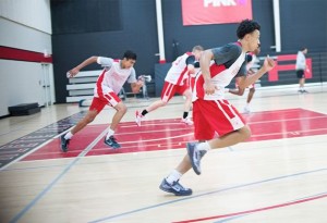 Jaelin Llewellyn of Orangeville Prep runs through after-school drills with his fellow students. Photo by James MacDonald.