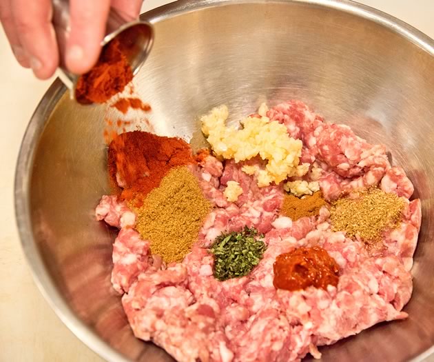 Mix a half quantity of the ingredients into the ground pork and mix well. Once combined, add the rest of the ingredients until well mixed. Refrigerate overnight to develop flavours. Photo by Pete Paterson. Styling by Jane Fellows.
