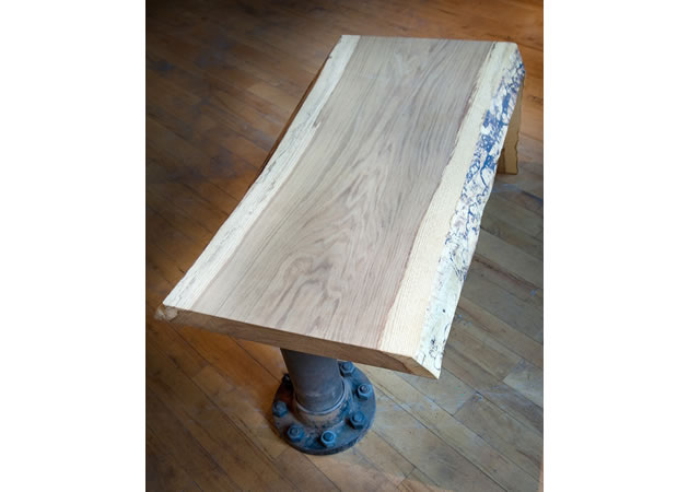 Erin furniture maker John Leenders, his pieces include this table and vintage faucet artwork. Photo by Rosemary Hasner / Black Dog Creative Arts.