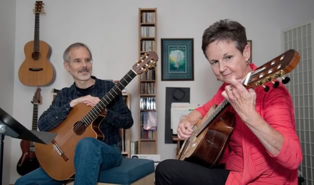 Lorraine McNally practises on the guitar made by her music teacher Daniel LaBrash (left). Photo by Rosemary Hasner / Black Dog Creative Arts.