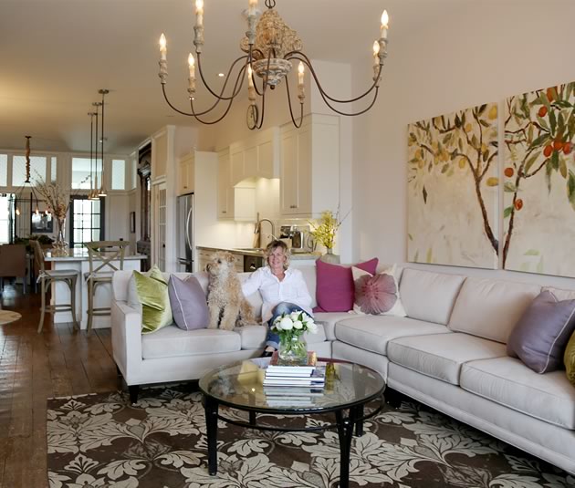 Kathleen Henning relaxes with her dog Frankie in the renovated, light-filled living quarters above her hair salon on Broadway. Photo by Pam Purves.
