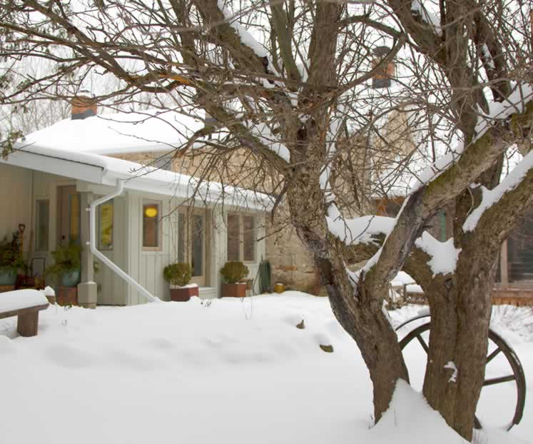 The additions of a study and entranceway to the original rear of the house and a screened porch to the south have added a lot of living space. Photo by Pam Purves.
