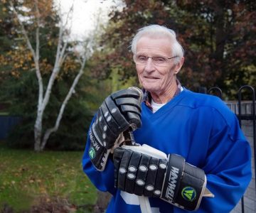 In his mid-80s, Bill Carnegie still plays old-timer hockey once a week and continues to lace up for practice three times a week. Photo by Rosemary Hasner / Black Dog Creative Arts.