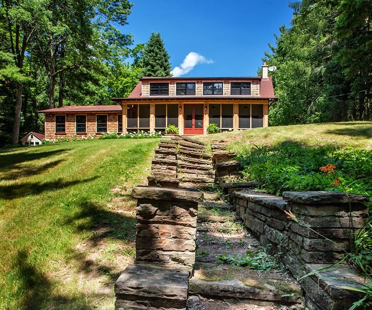 The property’s original stone steps veer a little to one side, but the owners love the patina and have no plans to replace them. Photo by Nat Caron.