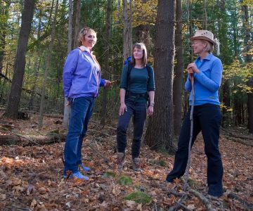 Nature therapy guide Kaitlyn Powers (centre) instructs writing pals Gail Grant (left) and Nicola Ross how to be still, breathe deeply and absorb nature with all their senses – followed by tea. Photo by Rosemary Hasner / Black Dog Creative Arts.