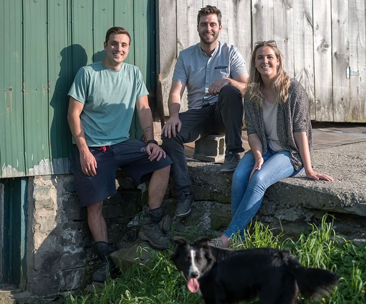 Troy Baxter, Mike Nuttall and Grace Wilkinson on the Wilkinson farm, where they brew Badlands beer. Photo by James MacDonald.