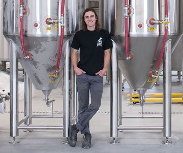 Calum Hill and his new stainless steel Sonnen Hill brewhouse. Photo by James MacDonald.