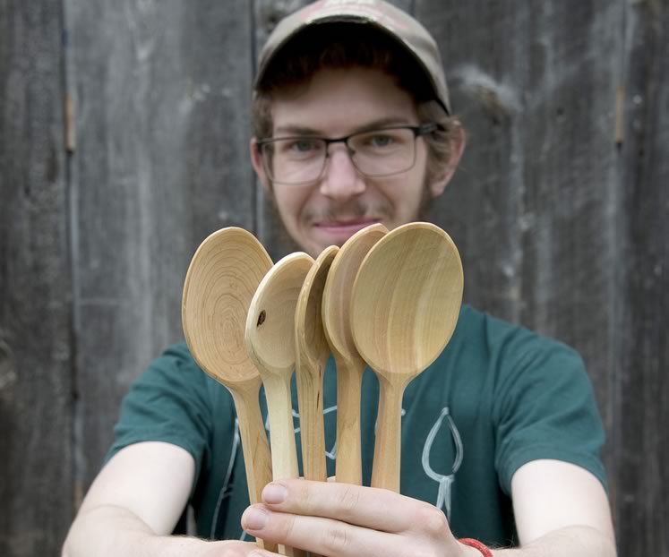 Woodcarver Peter Moule in his Hockley Valley workshop, using an axe and hand tools to craft the smooth wooden spoons he sells under the Hockleycrest Spoon Company banner. Photo by Pete Paterson.