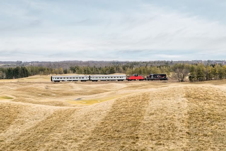 The Credit Valley Explorer glides through the rolling hills at Caledon’s Osprey Valley Golf Club during its final excursion on the OrangevilleBrampton Railway on February 30. New operator Gio Railways has no immediate plans to bring back the tourist service. Photo by Warren Schlote.