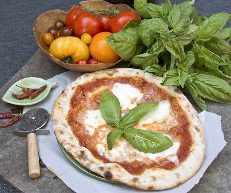 Four Corners’ classic Margherita pizza features a fresh tomato sauce, buffalo mozzarella and fresh basil on a thin homemade crust. Photo by Pete Paterson.