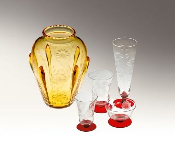 This amber vase was specially cut by Robert Hughes, Jack’s twin brother, for his wife. Such one-of-a-kind pieces are highly valued by collectors. The glasses with the ruby-red bases, cut on blanks from a one-off shipment from Czechoslovakia, are likewise valued for their rarity. Photo by Pete Paterson.