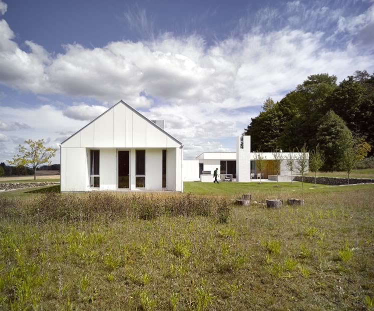 Crisp and white, Compass House, designed by Toronto architecture firm Superkül, sits on a 200-acre property in the hills of Mulmur. Photo by Ben Rahn / A-Frame Studio.