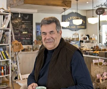 Eduardo Lafforgue enjoys a java at The Common Good Café and General Store in Belfountain. He cites the store and the heritage building it occupies as the kind of business that could effectively target the tourist trade even as it maintains its cozy rural character. Photo by Pete Paterson.