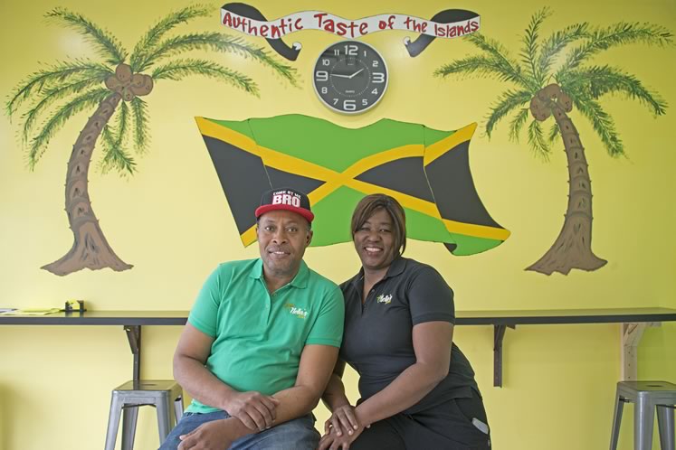 Arnella Levy and her husband, Nigel Spencer, at Nella’s Jerk. Photo by Pete Paterson.