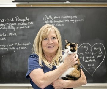 Sharon Morden and Raccoon (since adopted) of Feral Cat Rescue in Melancthon. Photo by Pete Paterson.