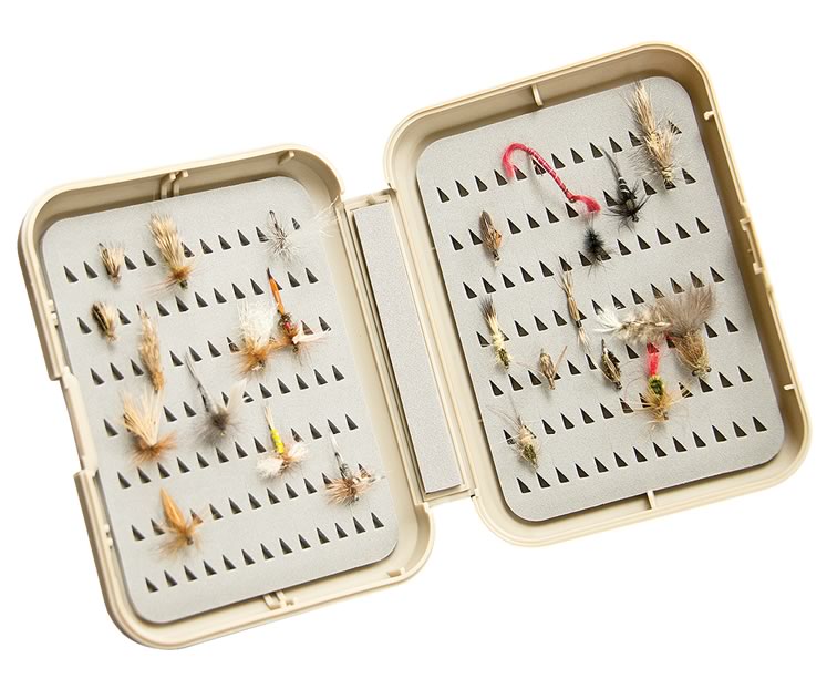 A fly tying case, is filled with ties created at each meeting and given away as a door prize. Photo by Pete Paterson.