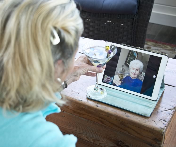 Quarantini with a twist: Writer Gail Grant settles in for a Skype chat with a distant friend. Photo by Pete Paterson.