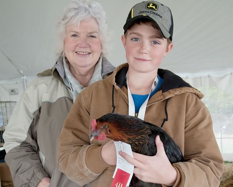 Longtime Wellington 4-H leader June Switzer and Sam McLean with Skittles, who took best in breed and best in show at the Fergus Fall Fair last year. Photo by Rosemary Hasner / Black Dog Creative Arts.