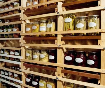 Karen stores her ample collection of preserves in a cold cellar. Photo by Rosemary Hasner / Black Dog Creative Arts.