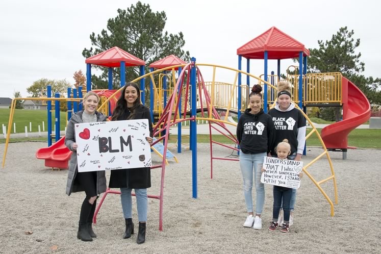 Hailey McLarty and Shyanne Wharton-Haines Ricci (left) organized the June 14 Shelburne Black Lives Matter march. Sisters Seanna (left) and Makenna Thomas (right), were behind the Orangeville march the same day and walked with little sister Emma. Photo by Pete Paterson.