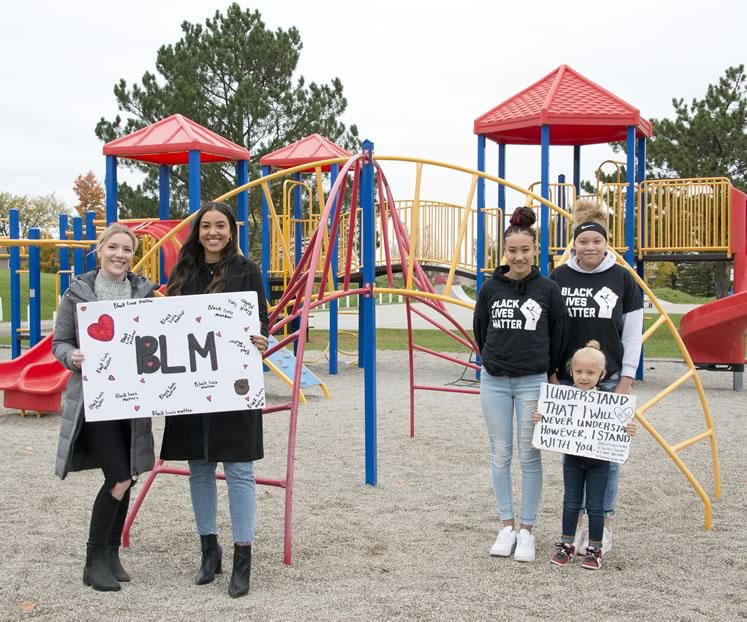 Hailey McLarty and Shyanne Wharton-Haines Ricci (left) organized the June 14 Shelburne Black Lives Matter march. Sisters Seanna (left) and Makenna Thomas (right), were behind the Orangeville march the same day and walked with little sister Emma. Photo by Pete Paterson.