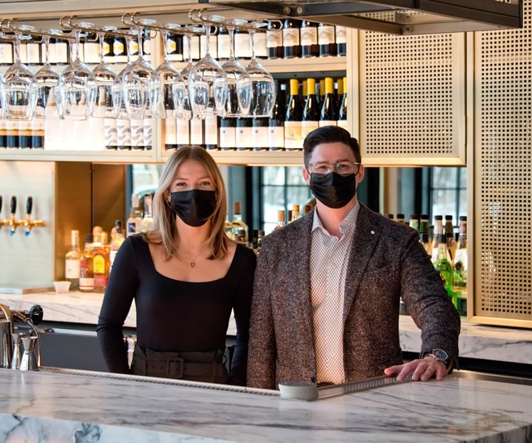 Greystones Restaurant and Lounge director of operation Danielle Hughes and co-owner Benn Froggett stand at the bar in the lounge. Photo by Pete Paterson.