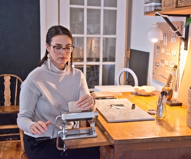 Jewelry maker Kristin Evensen at work in her Orangeville studio. Photo by Pete Paterson.