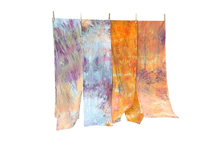 Snow-dyed scarves drying on a clothesline. Photo by Pete Paterson.