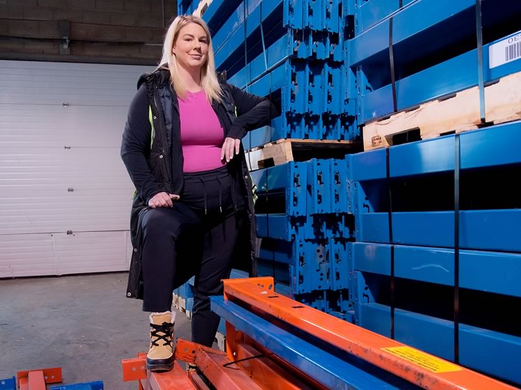 Grand Valley’s Jenna Brooks stands amid the storage racks her Mississauga-based company, Racked Out Inc., installs for clients. Photo by Rosemary Hasner / Black Dog Creative Arts.