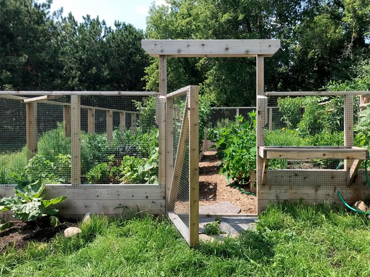 Mark Gorski of Erin’s Gourmet Garden Organics designed this fenced-in vegetable garden around raised beds and walkways covered in wood chips. Photo courtesy Mark Gorski.