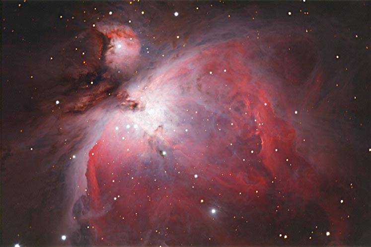 The Orion Nebula, located in The Hunter’s “sword,” is a vast cloud of dust that will give birth to new stars. Photo by Brad Heide.