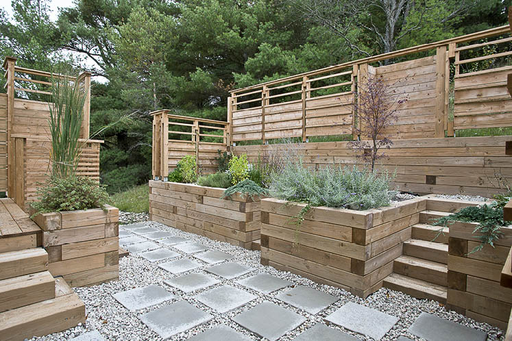 Echoing the house design, this modular, manicured garden sits outside the couple’s bedroom.