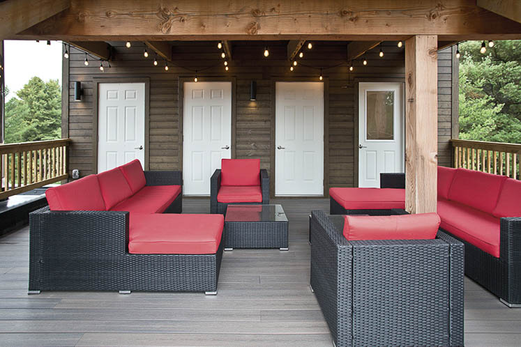 An outdoor seating area offers a rare hit of bright colour in the Bendas’ calm, neutral palette.